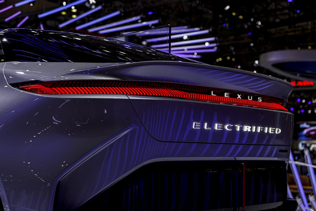 Close-up of an electrified Lexus model showcased at an automotive exhibition.