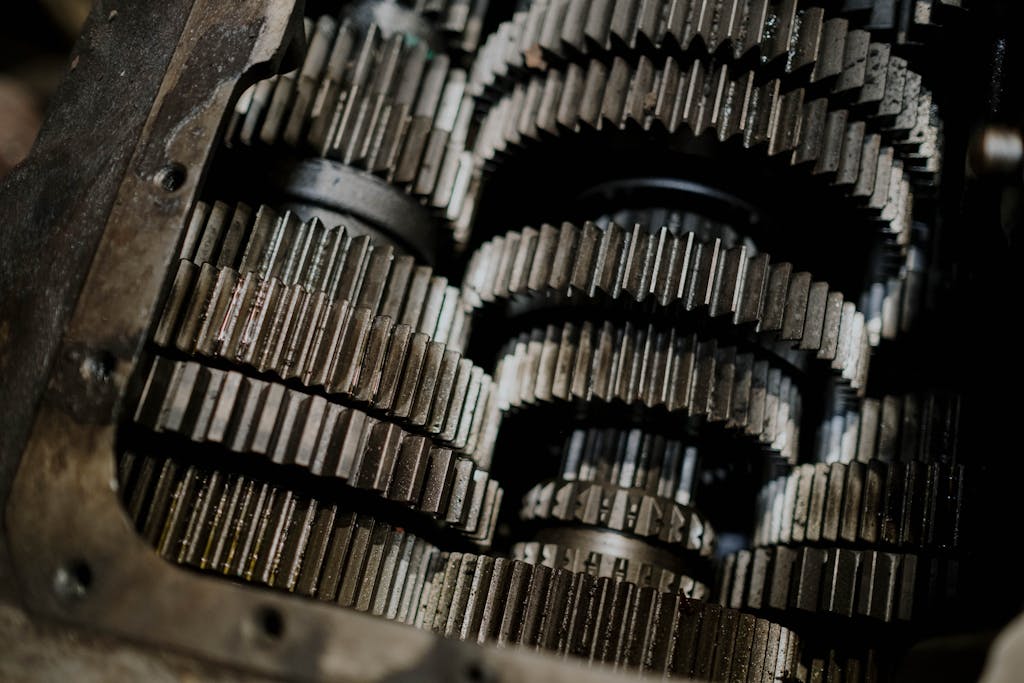 Detailed shot of mechanical gears showcasing intricate steel parts and engineering precision.