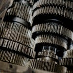 Detailed shot of mechanical gears showcasing intricate steel parts and engineering precision.